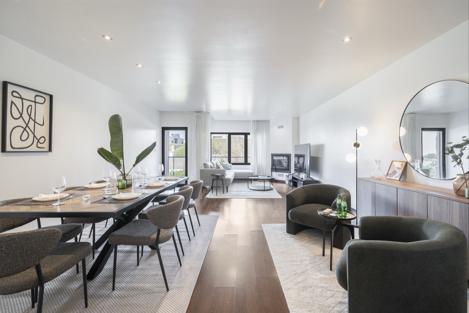 Open-plan living and dining room with wood floors