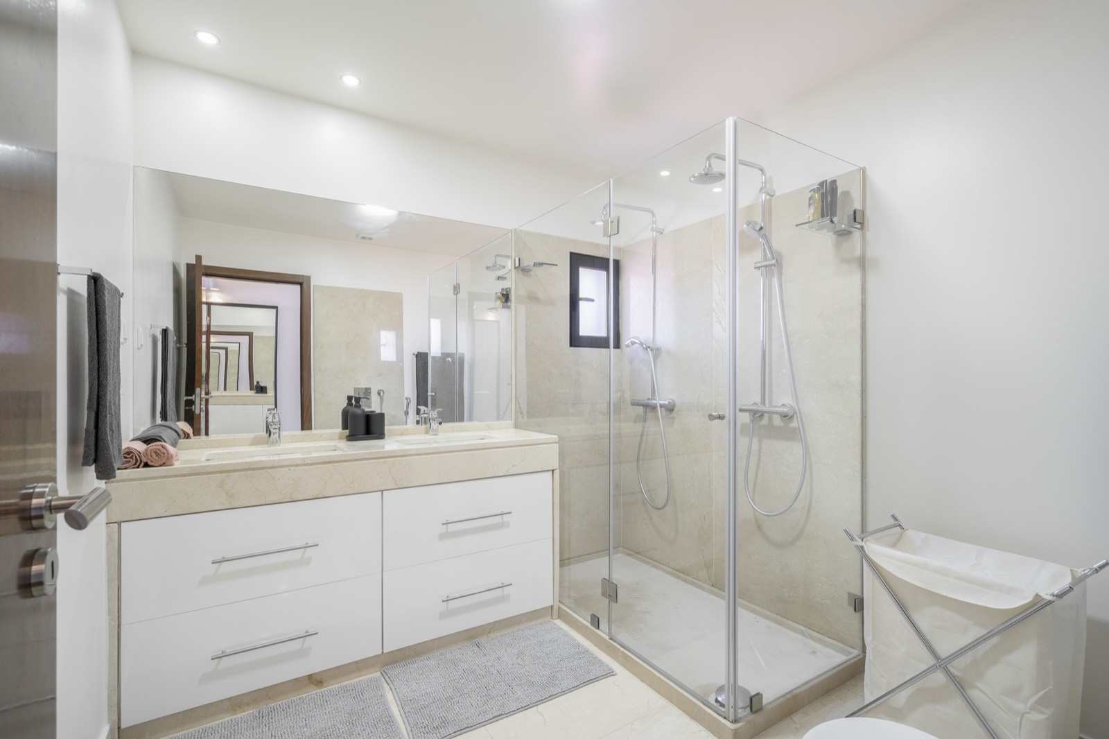 Family bathroom with double vanity and walk-in shower