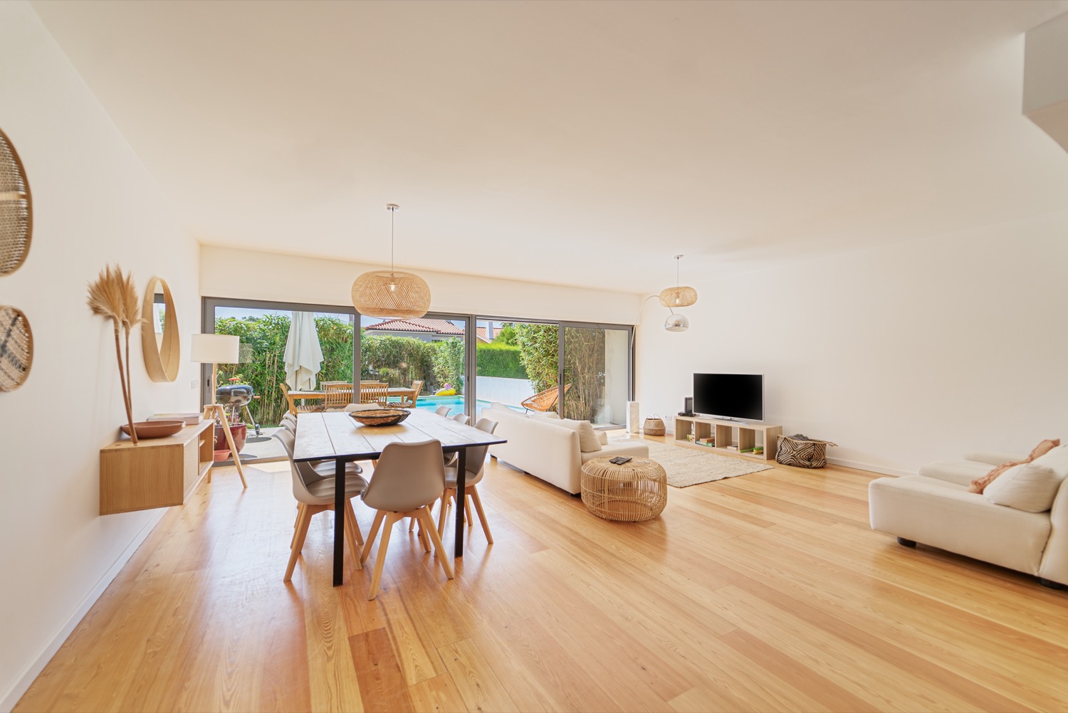 Main-floor living and dining room opening to the pool
